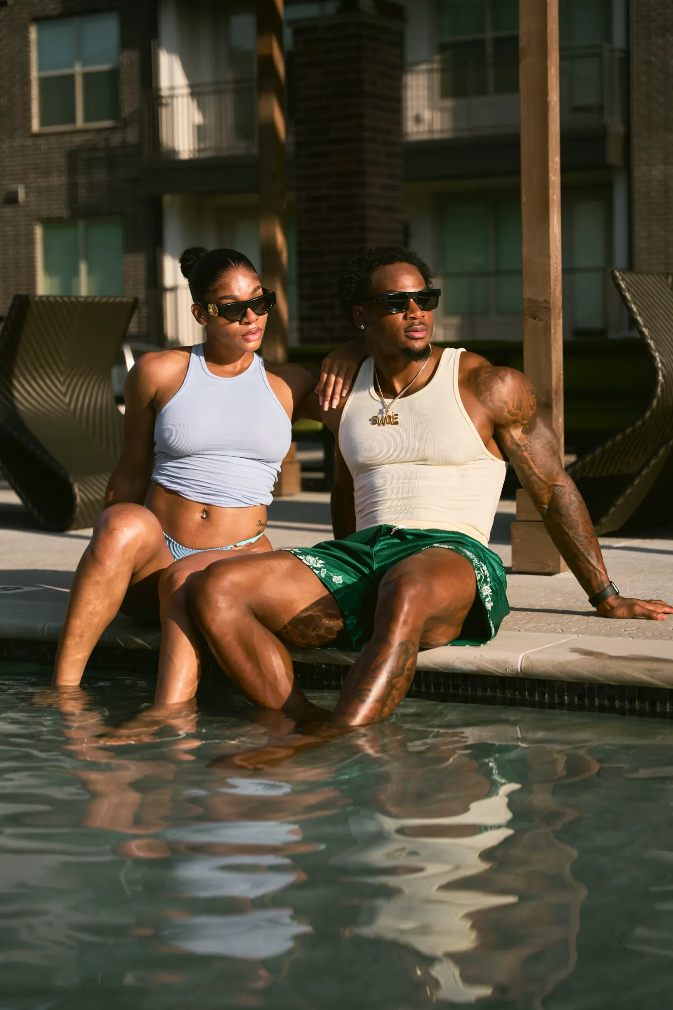 Fitness creator couple at poolside