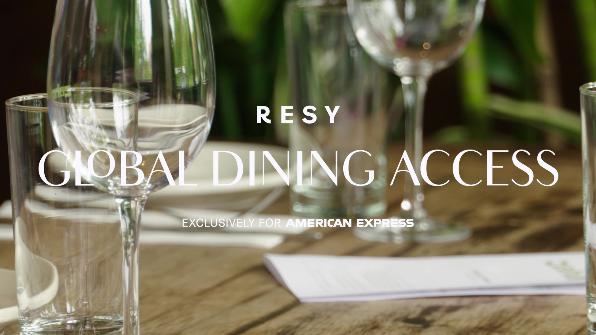 Wine glasses on a restaurant table — RESY Global Dining Access still