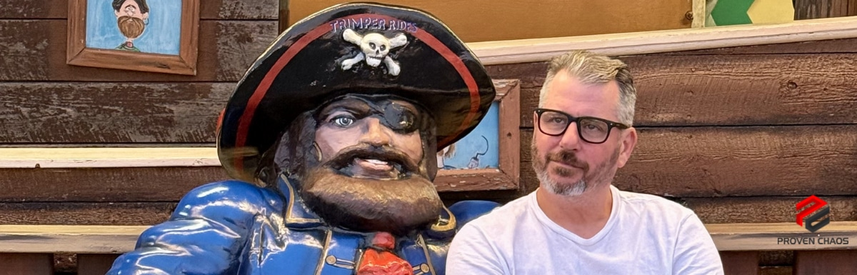 Jerry Macnamara beside a pirate statue