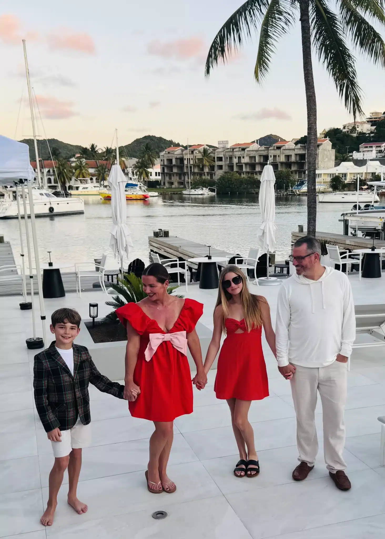 Jerry Macnamara and his family on a marina terrace at sunset