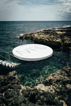 NARS circular platform on the rocky Italian coastline