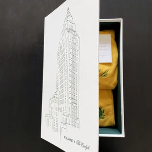 Frame x The Carlyle gift box with a yellow sweatshirt