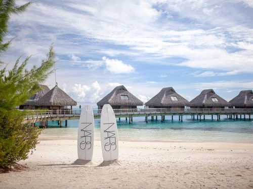 NARS branded surfboards on a Bora Bora beach