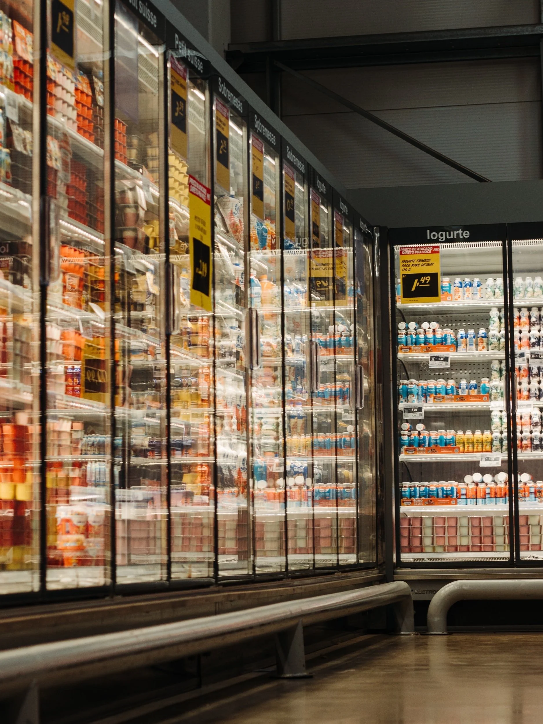 Supermarket freezer aisle lined with glass doors