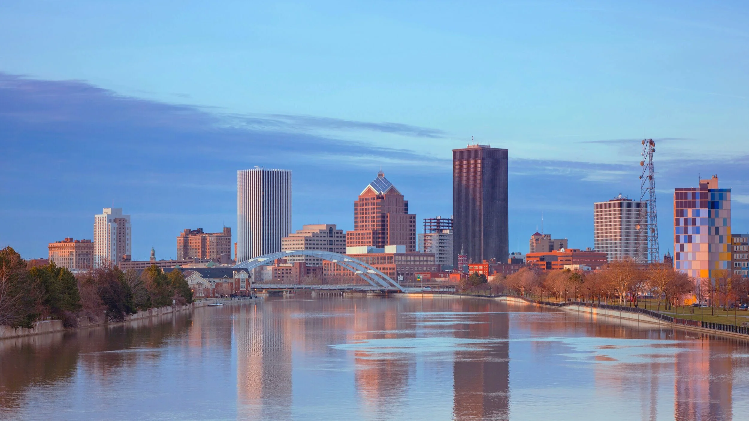Rochester, NY downtown skyline reflected in the Genesee River at dusk