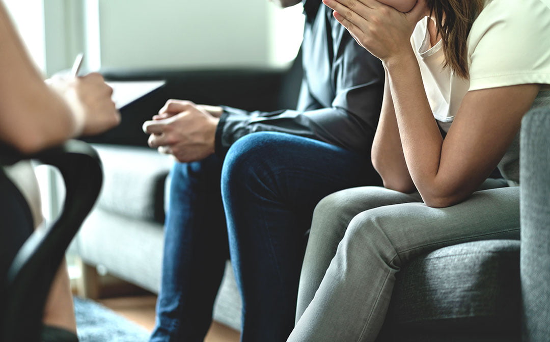 Couple in a counseling session with a therapist