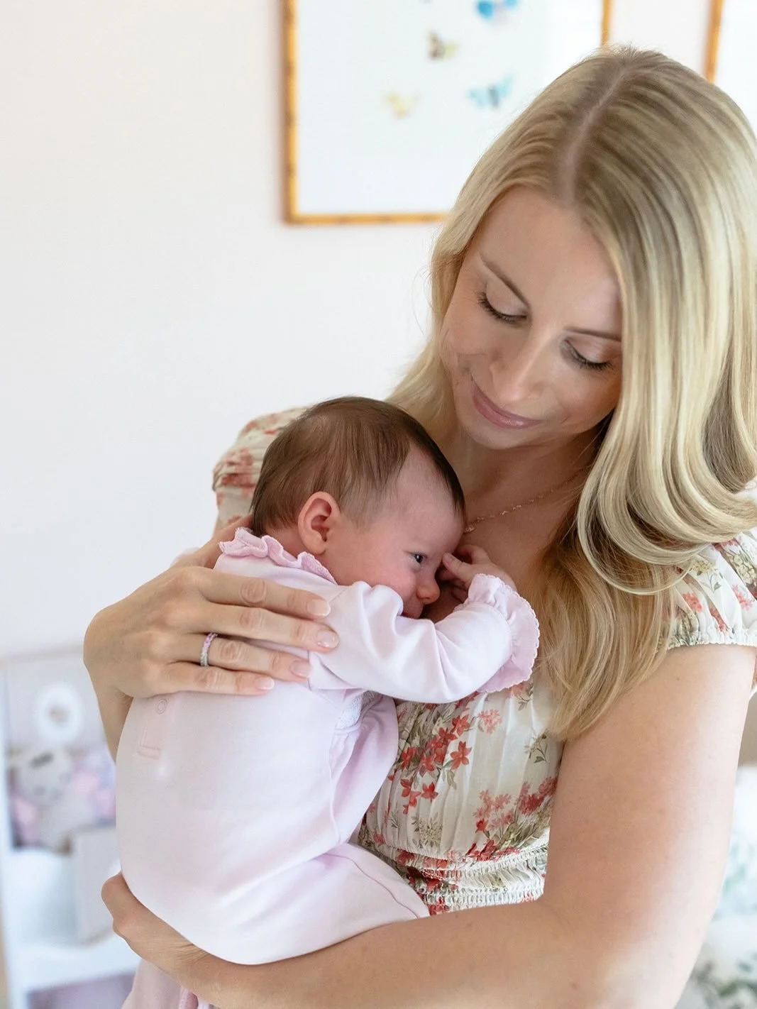 Instagram post: Kirsten holding her newborn, back from maternity leave