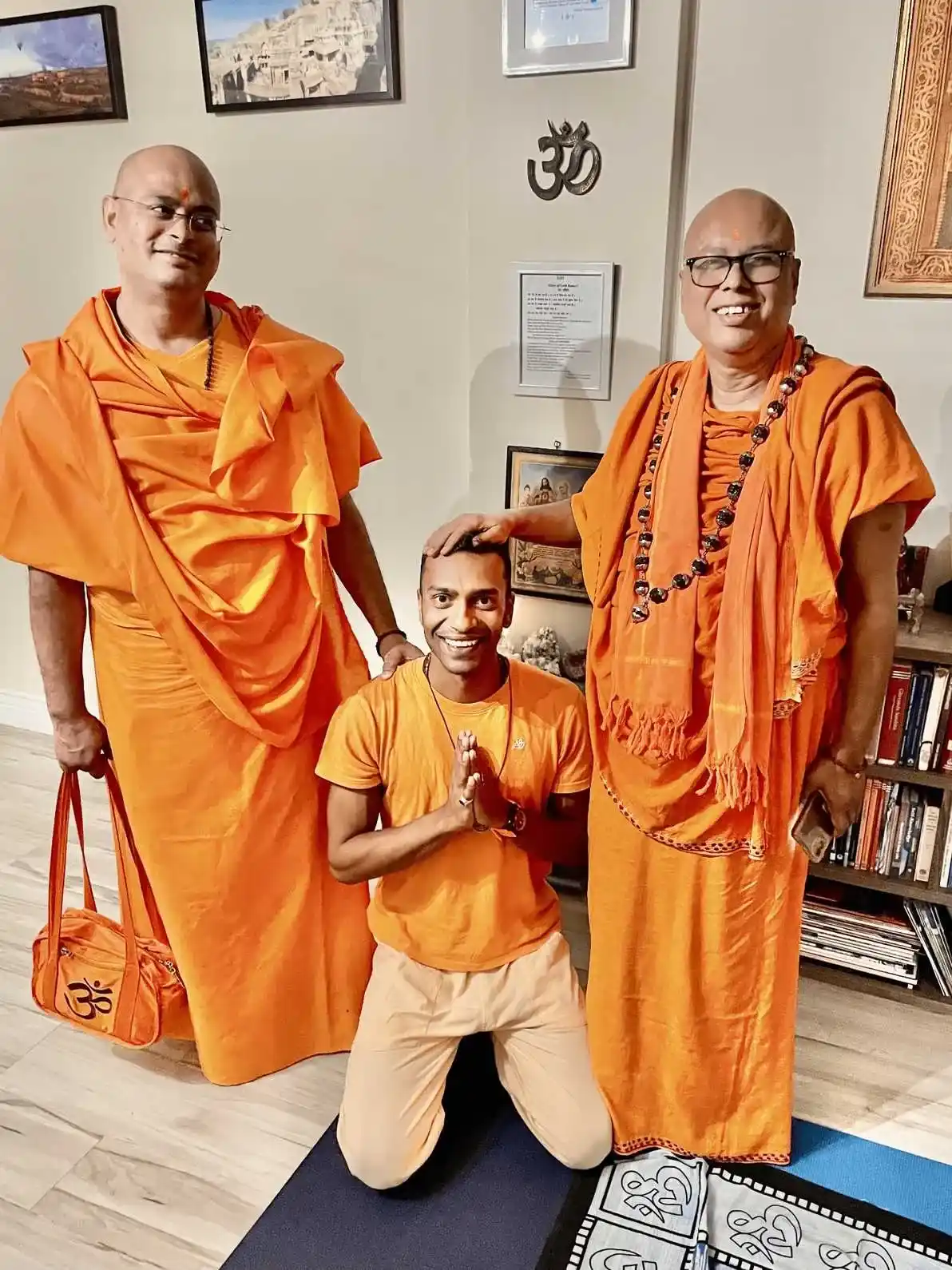 Swamis in orange robes inside the ashram