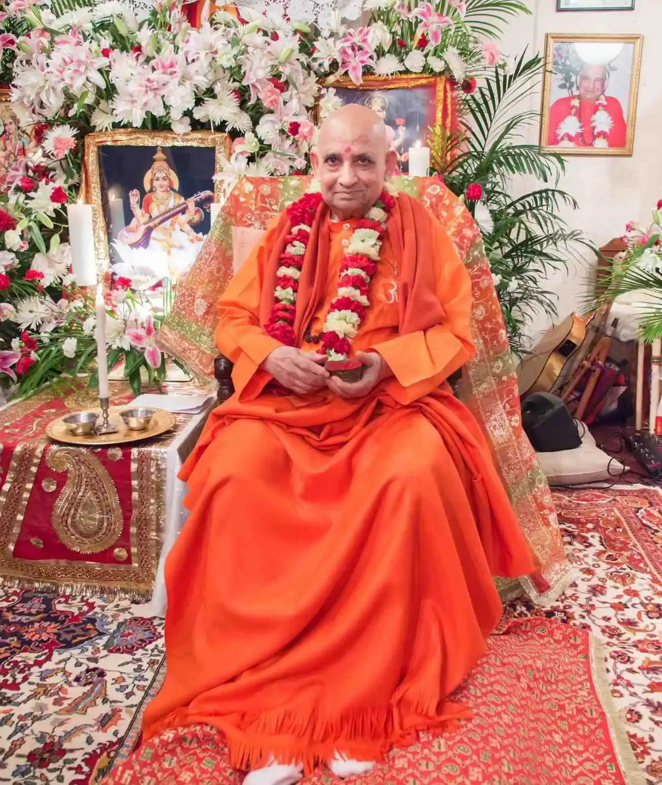 Swami Rajarshi Muni seated at a ceremonial altar