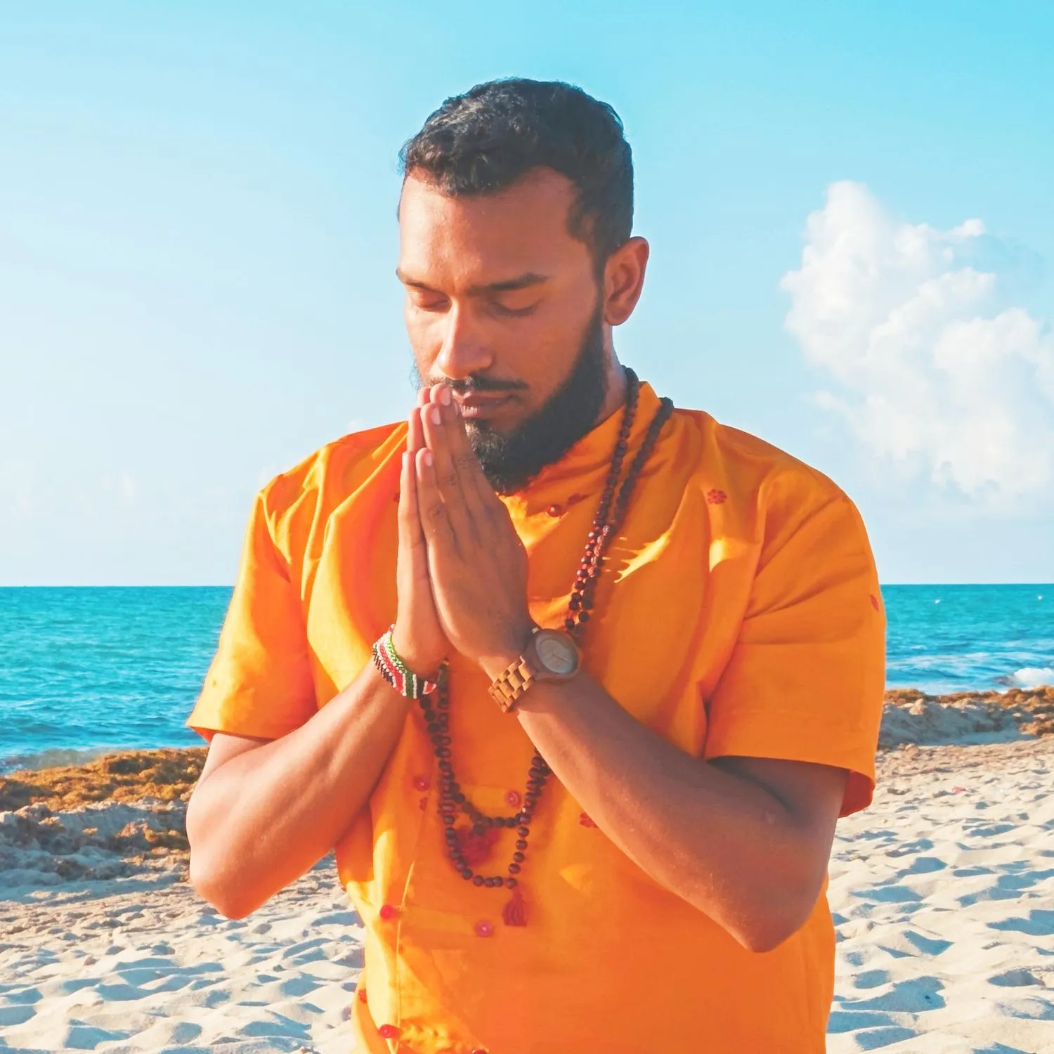 Sri Sudarshan praying on the beach