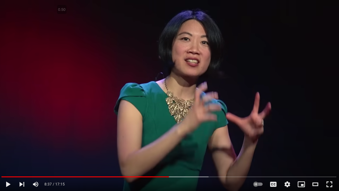 Anna Choi delivering her TEDx talk on stage