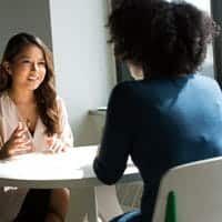 Two women in a one-on-one coaching conversation
