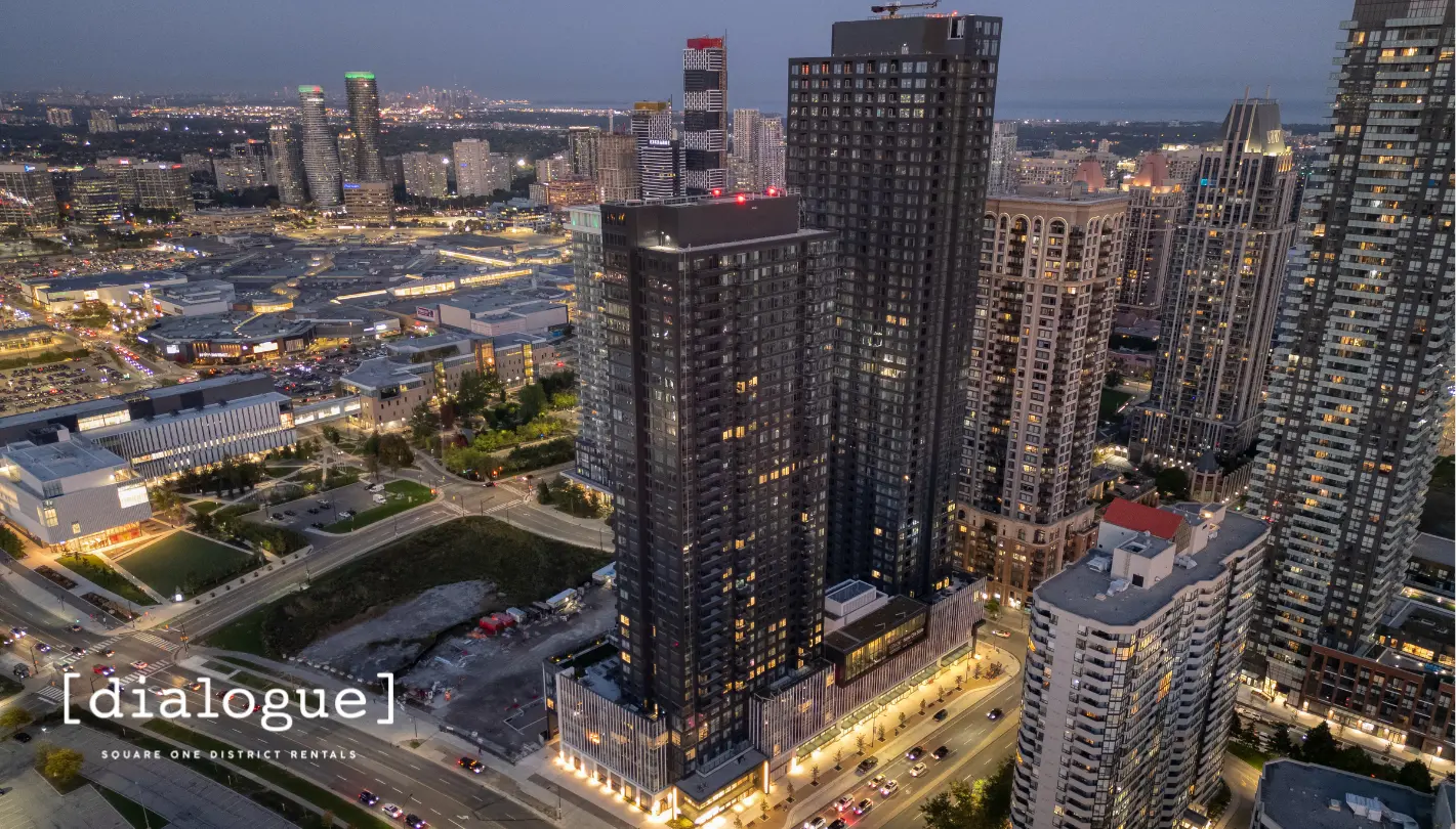 Aerial dusk view of the Dialogue residential towers with the Mississauga skyline behind