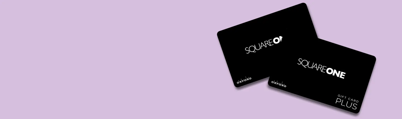 Two black Square One gift cards on a lavender background