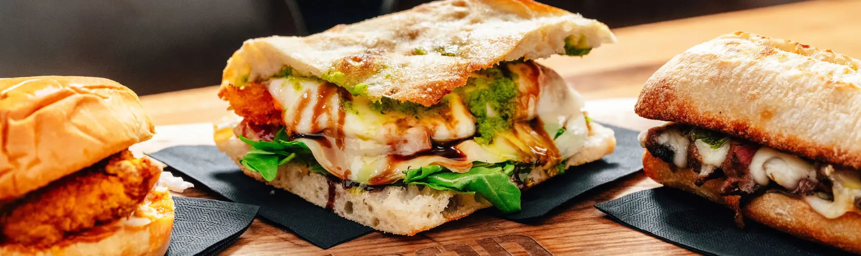 Grilled Italian paninis on a wooden board