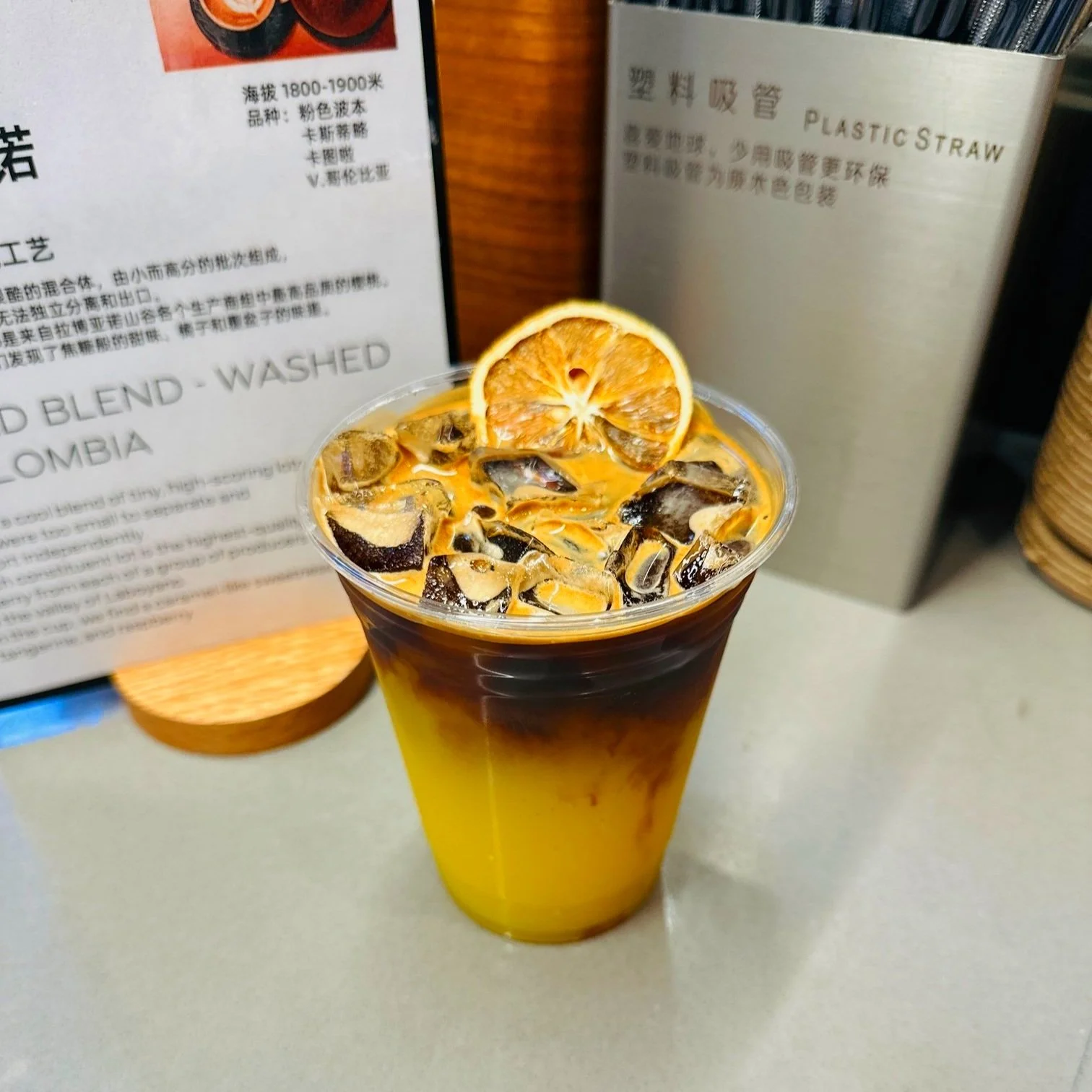 Orange Iced Americano 橙香冰美式 — layered iced americano with a dried orange slice garnish