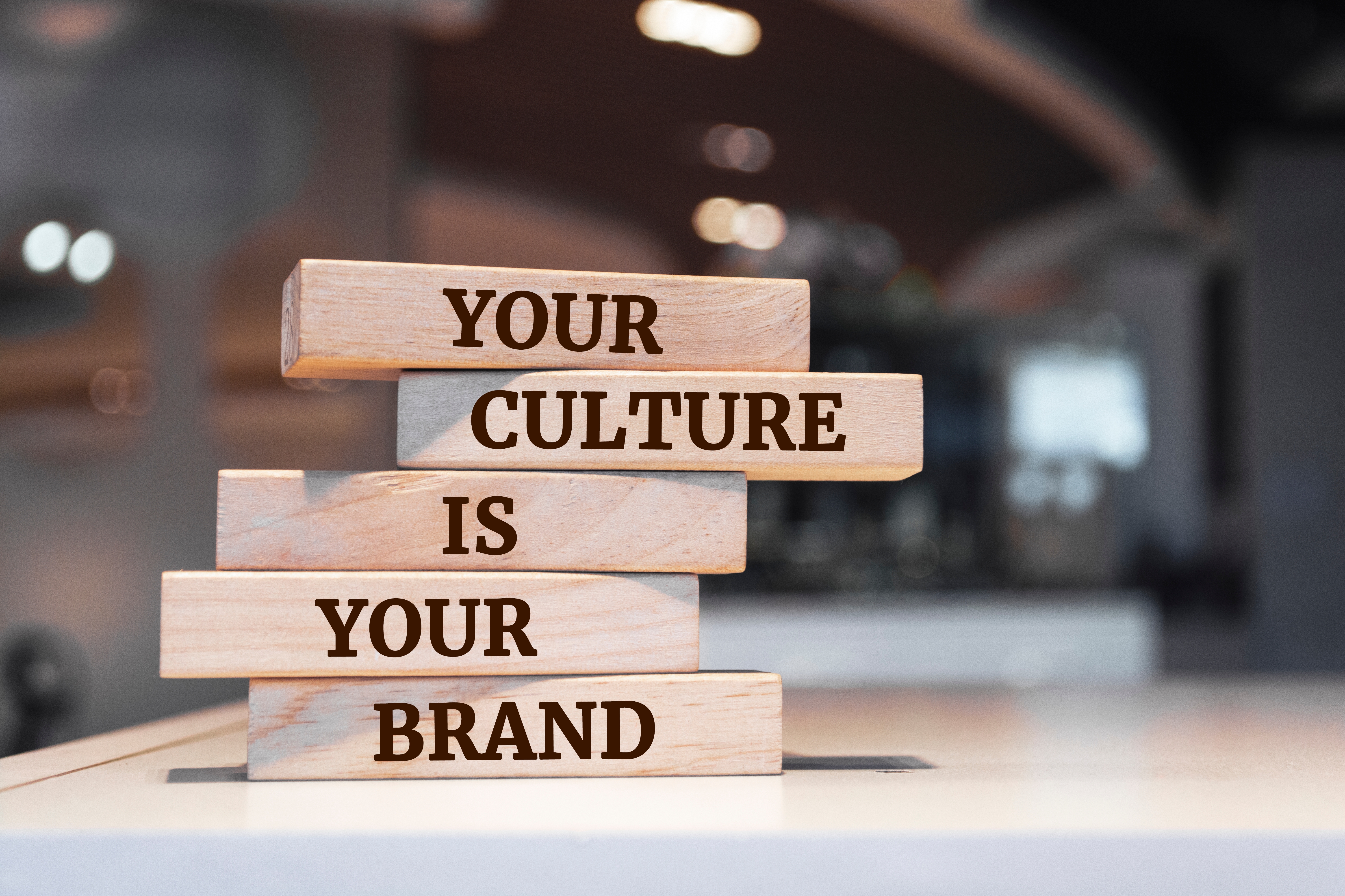 Stacked wooden blocks reading Your Culture Is Your Brand