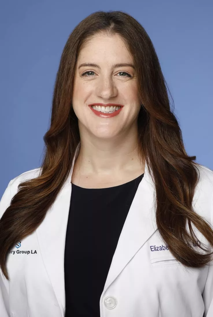 Portrait of Dr. Elizabeth Arena in a Surgery Group LA white coat