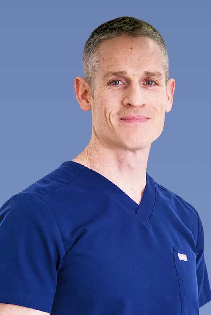 Portrait of Dr. Raanan Meyer in navy scrubs