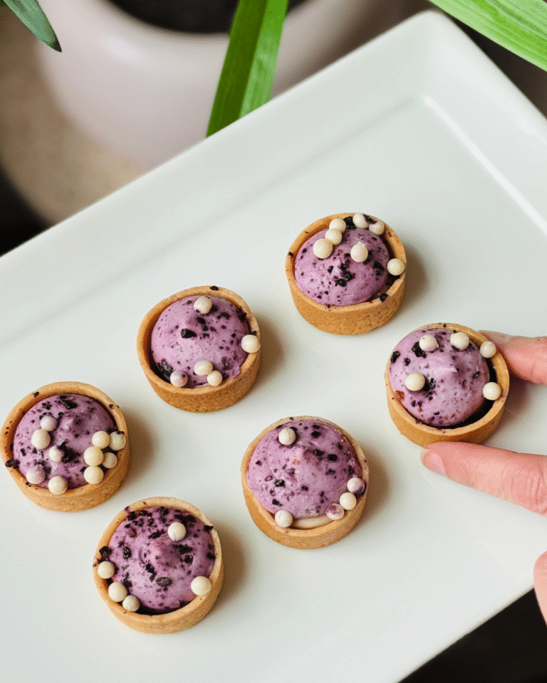 Blueberry cream tartlets plated for a New York Fashion Week event