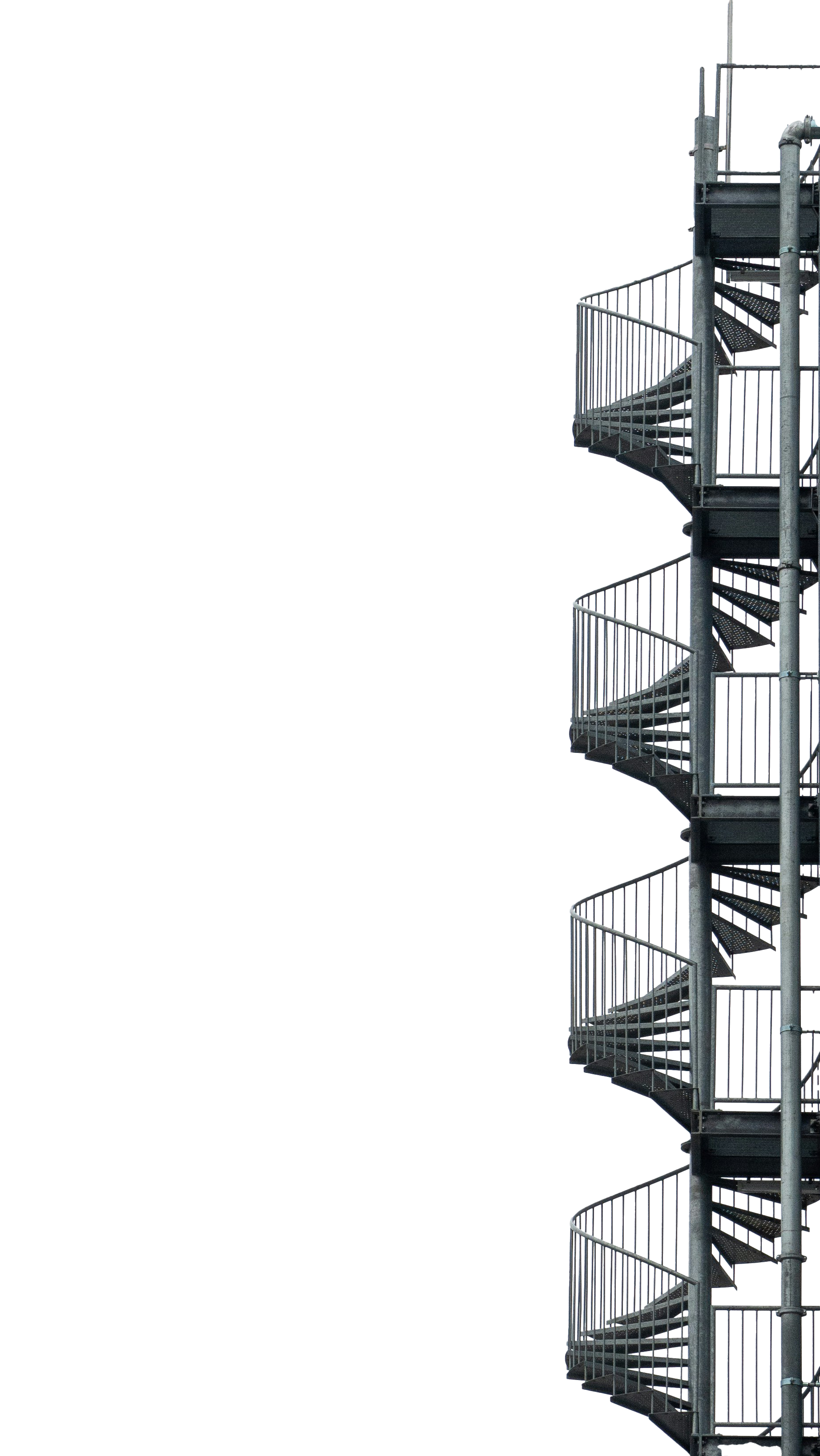 Industrial metal spiral staircase ascending on a black background