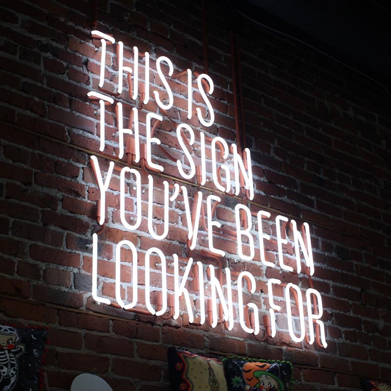 Neon sign reading 'This is the sign you've been looking for'