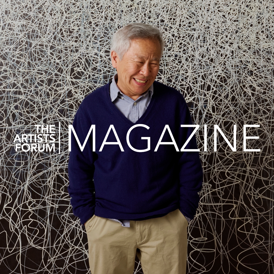 Artist Il Lee smiling in front of his densely scribbled ballpoint line work