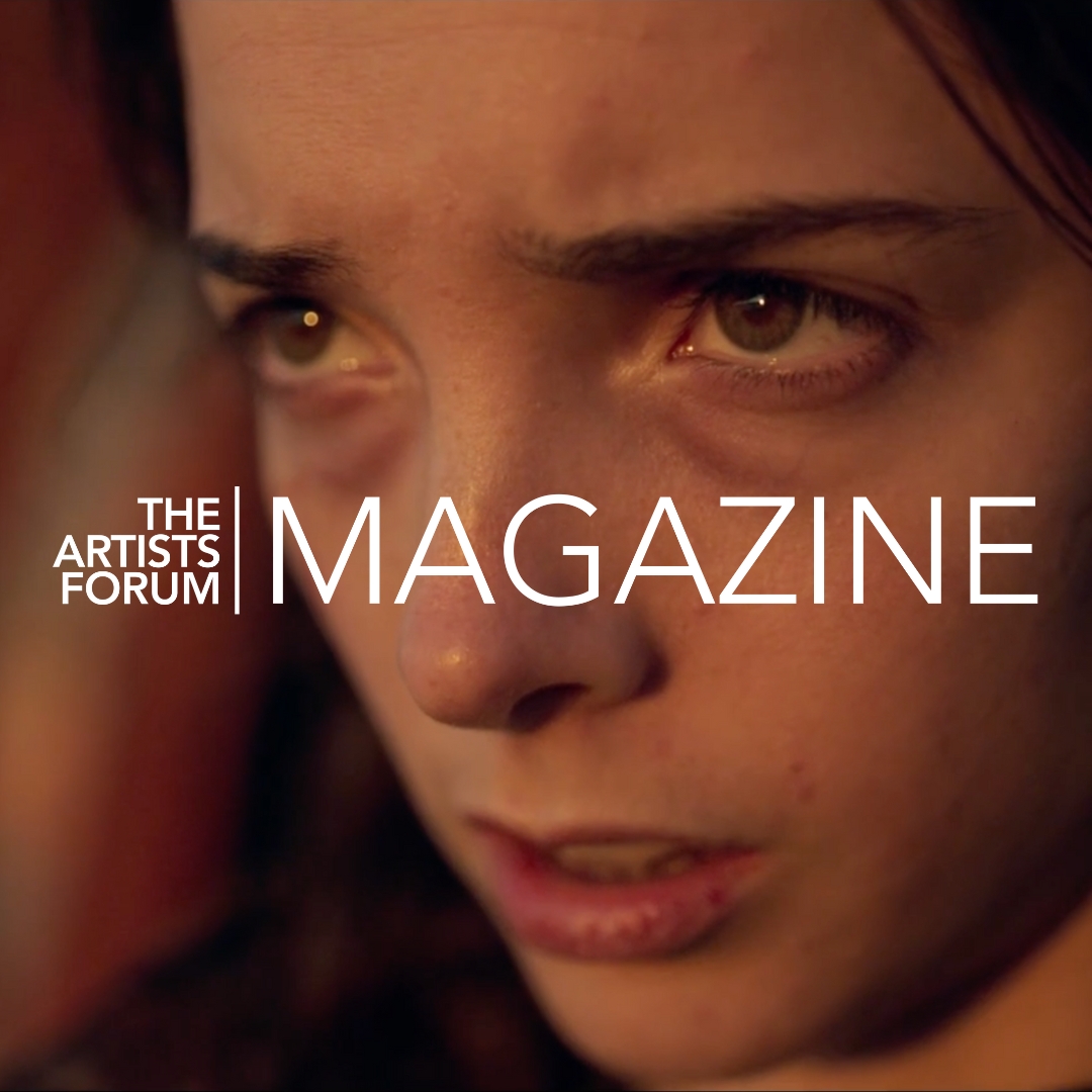 Extreme close-up of a young woman's face with an emotional expression