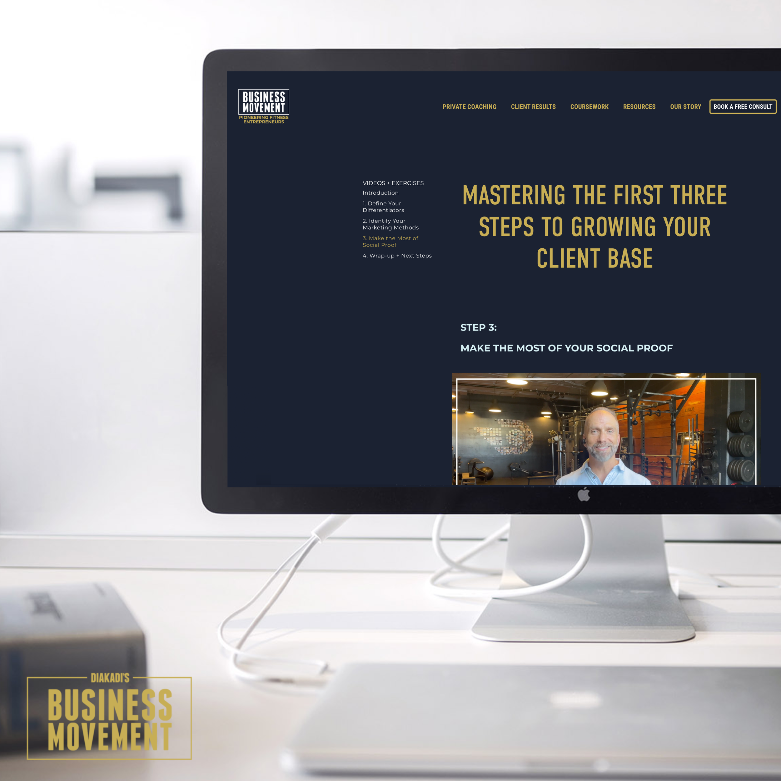 iMac mockup displaying The Business Movement course platform