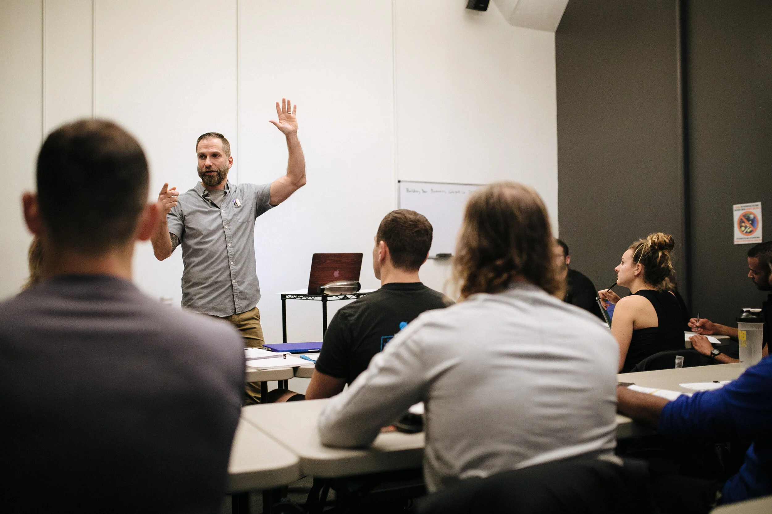 Billy Polson presenting to a small classroom of fitness professionals