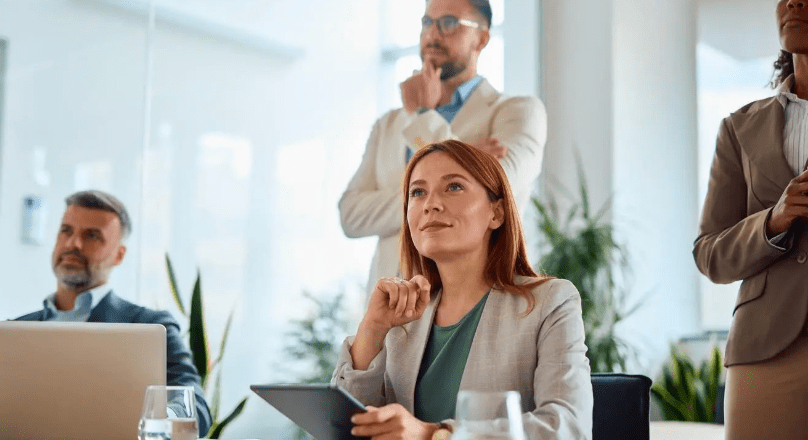Professionals in a bright conference room