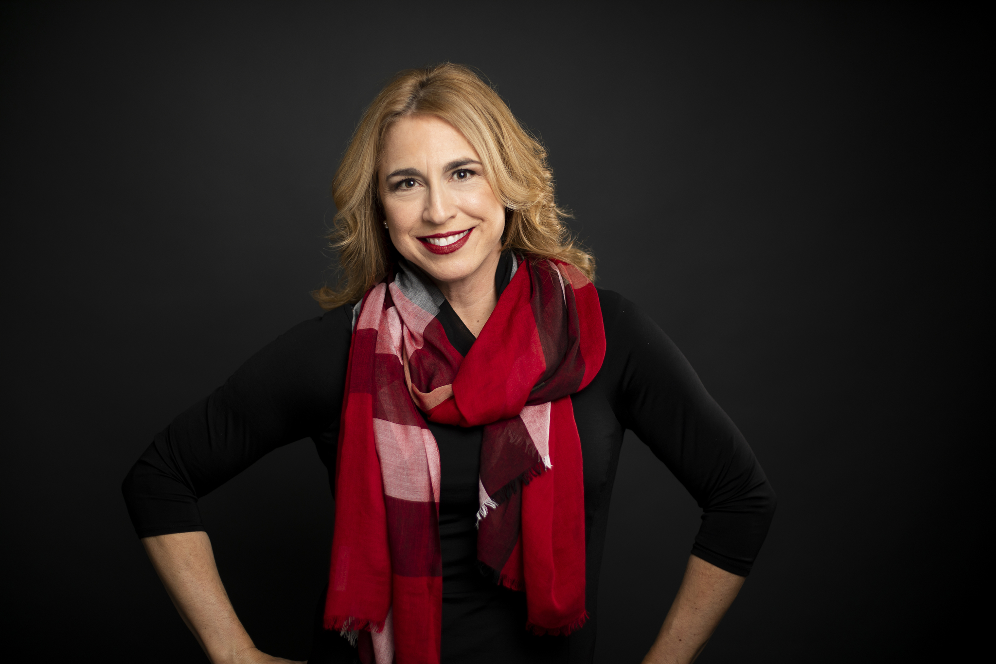Terry Kraft, professional headshot with a red scarf