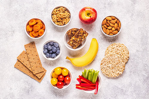 Overhead flat-lay of healthy snacks and fruit at The Rest Spot