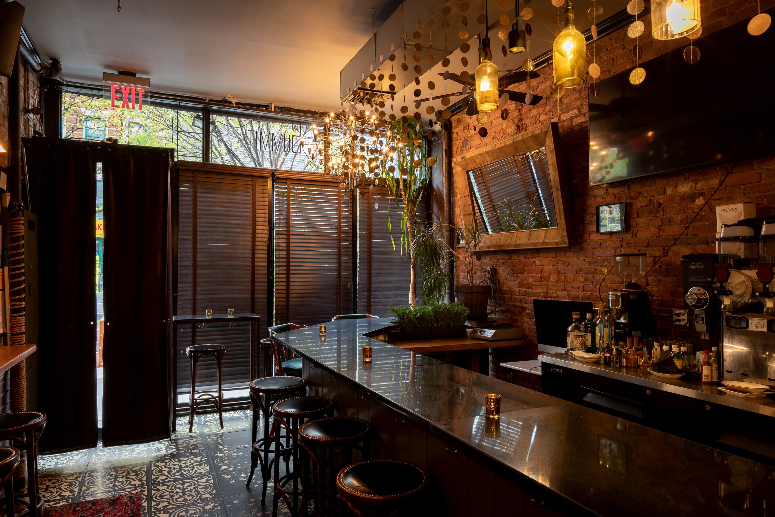 The bar's entrance and front windows at night