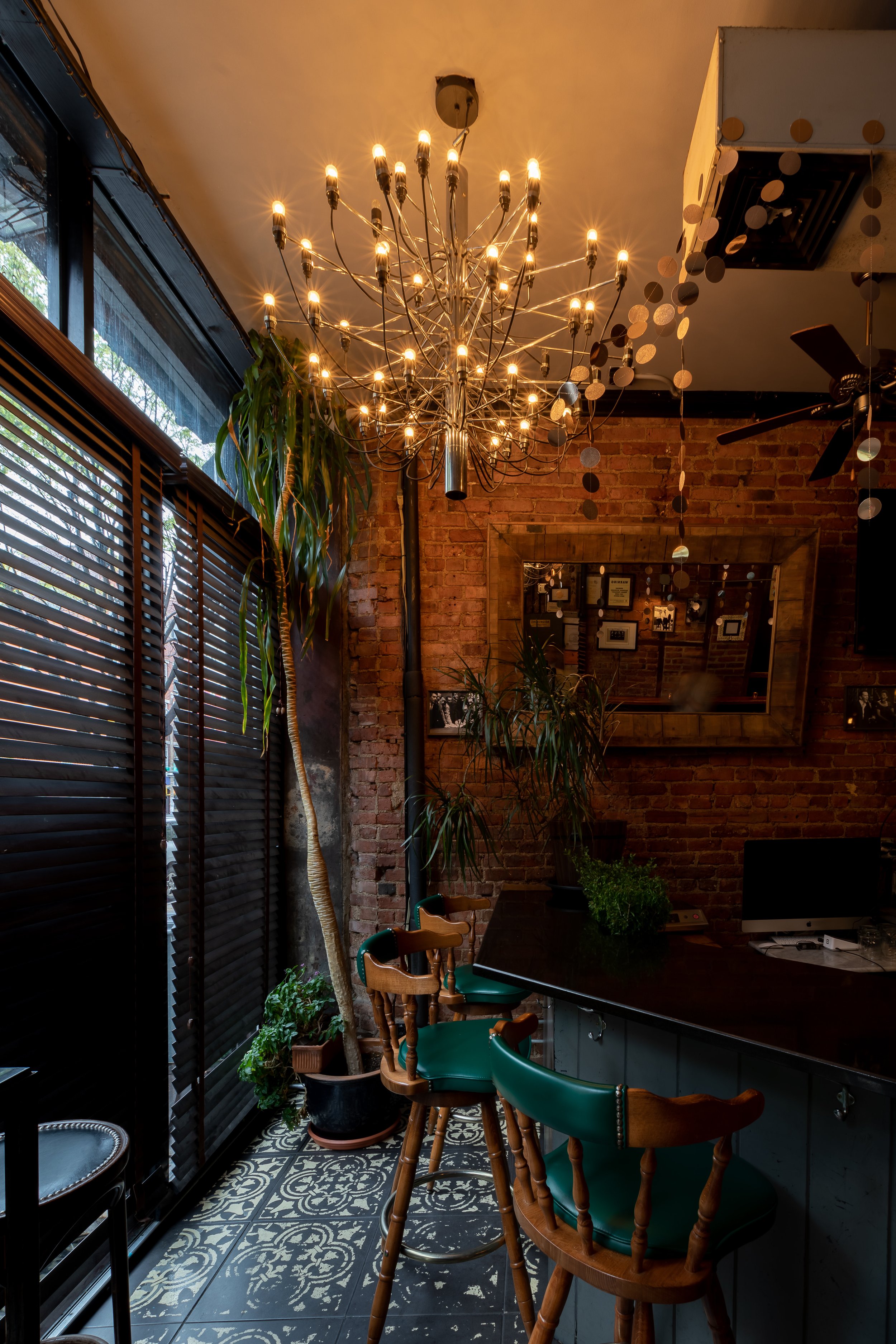 Warm lamplight across the bar counter