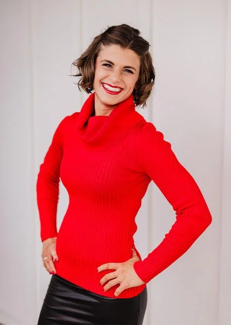 Andrea Singsaas in a red turtleneck — leadership development coaching