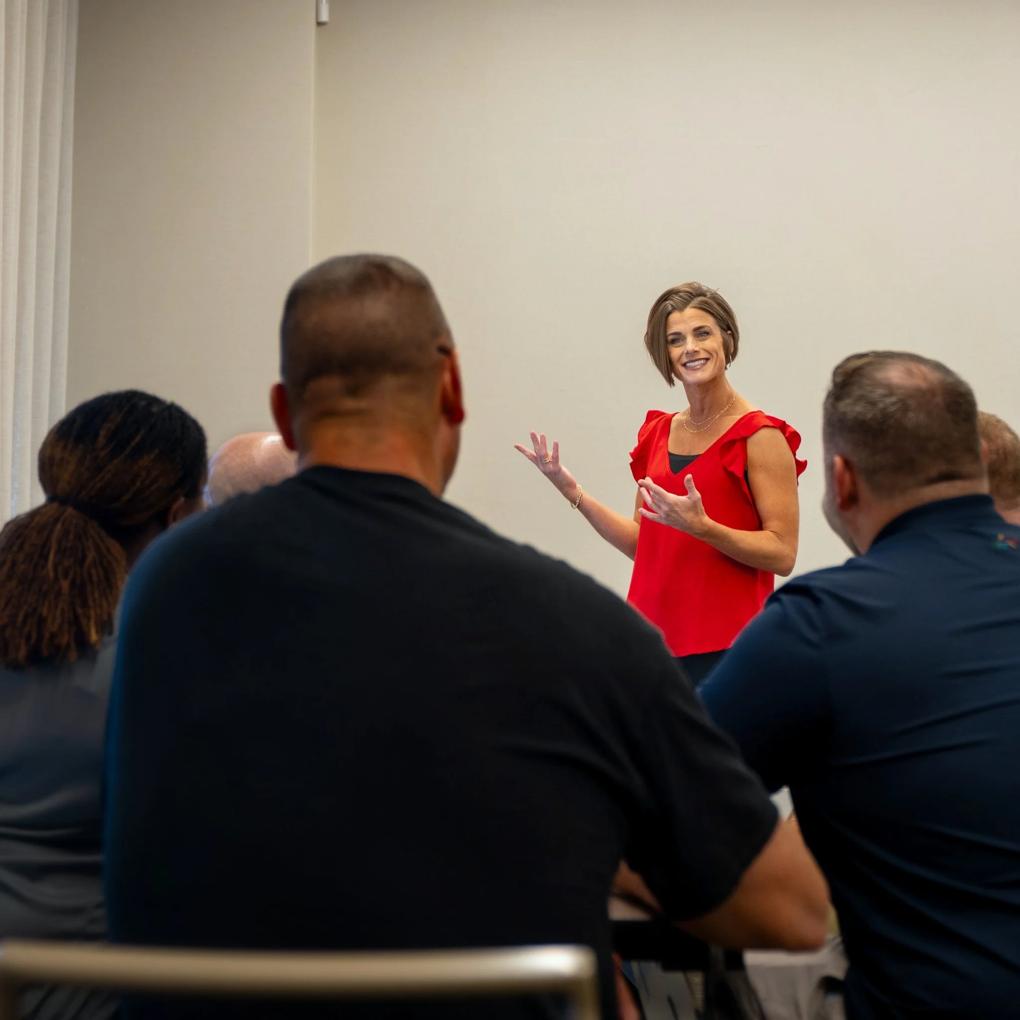 Andrea Singsaas leading a leadership workshop with a seated group