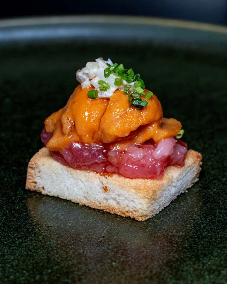 Toast with toro tartare, uni, onions, mayo and chives