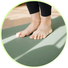 Bare feet on a green yoga mat