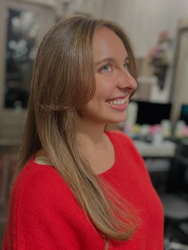 Client with long straight blonde highlighted hair