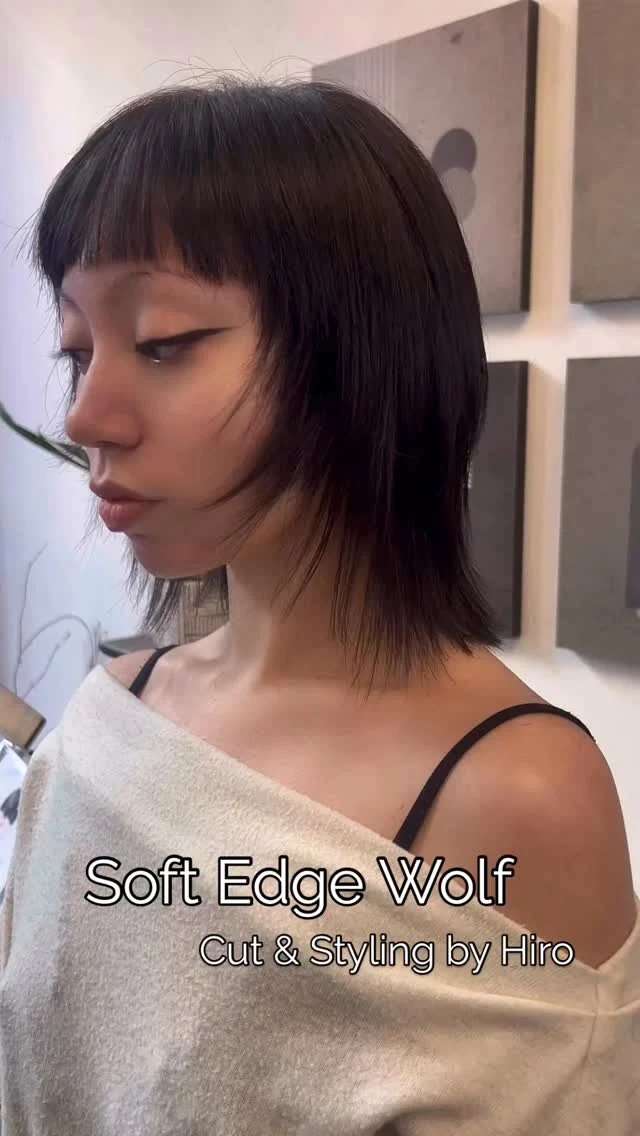 Client with a soft edge wolf cut, dark bob with bangs