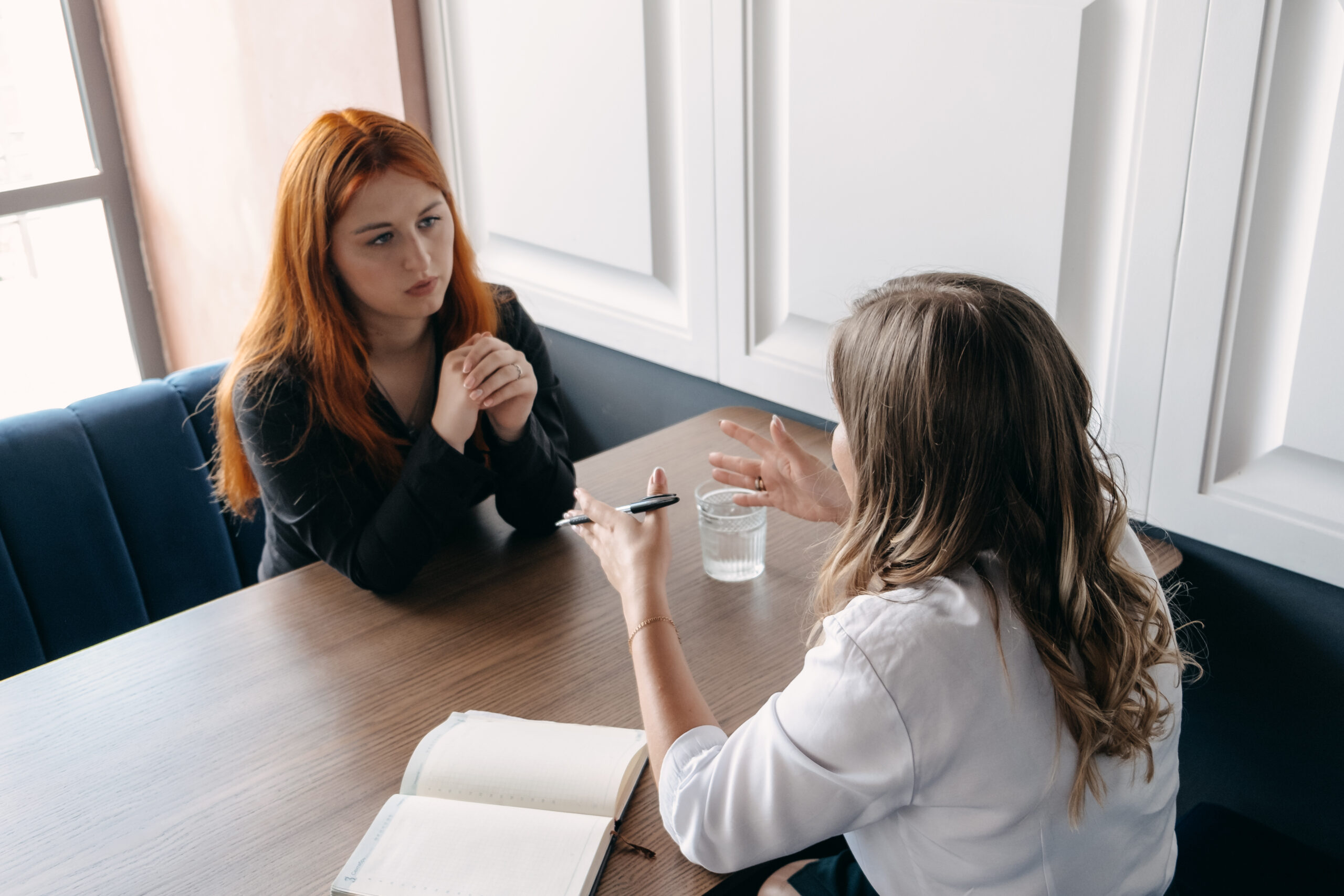 A one-to-one coaching session across a table