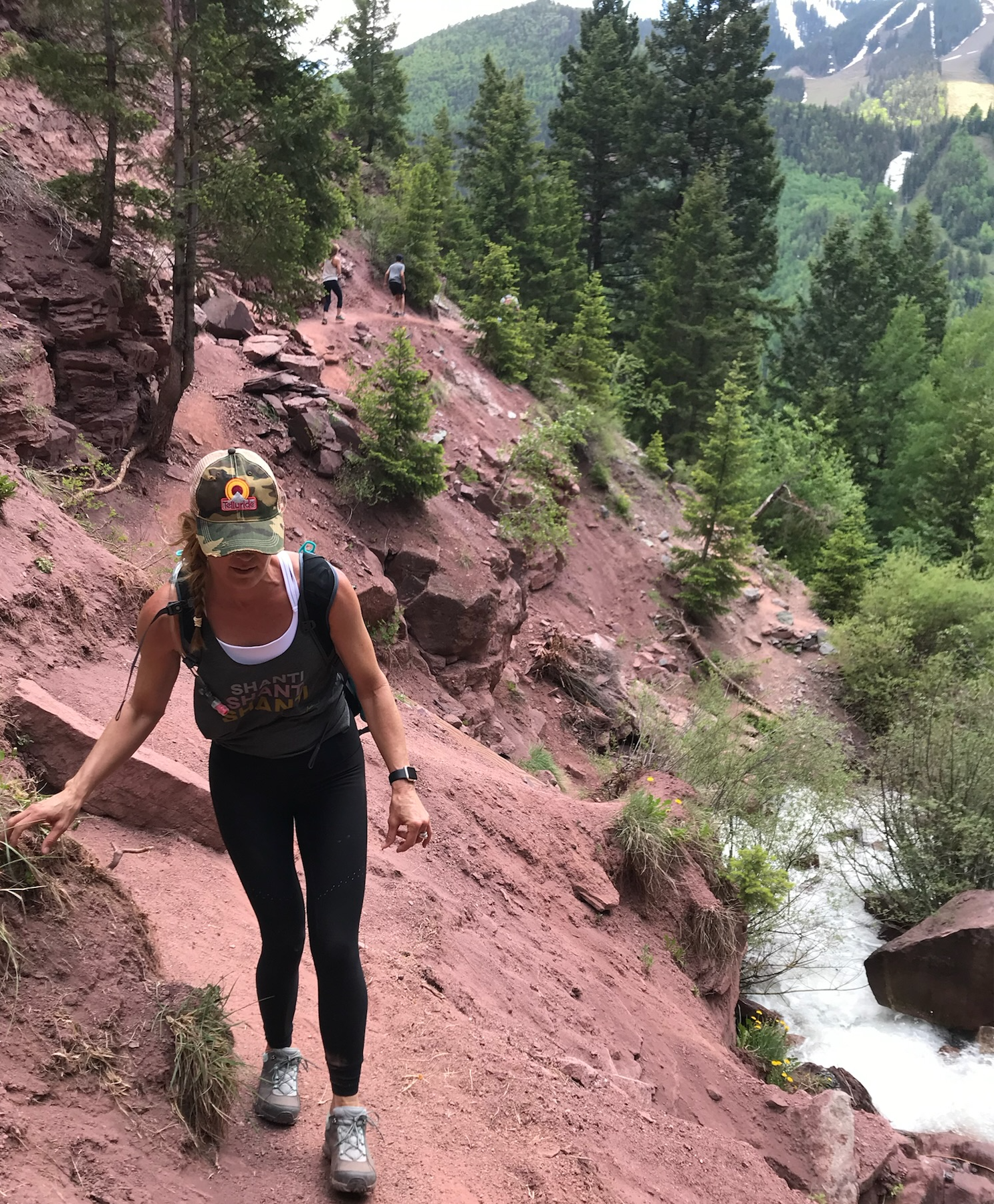 Michelle Johns walking along the side of a steep hill