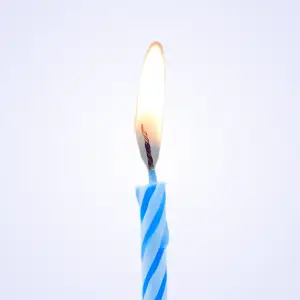 A single blue candle burning