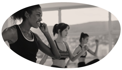 Women exercising together in a bright studio