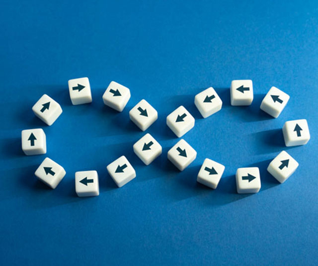 White dice with arrows forming an infinity loop on a blue background