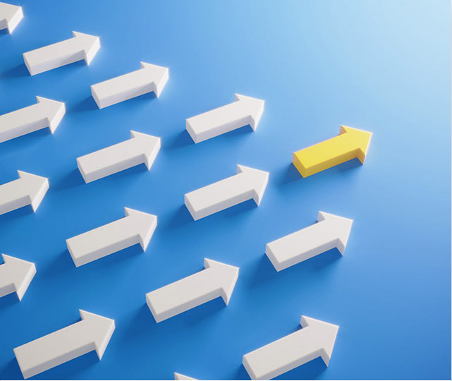 Rows of white arrows with one gold arrow leading ahead