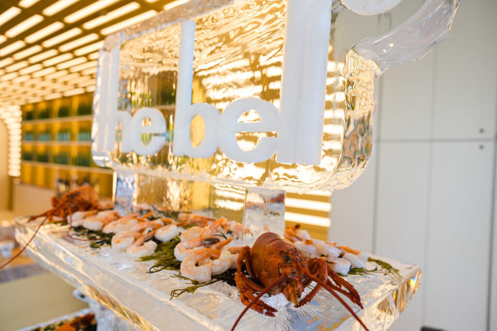 Branded ice sculpture with a shrimp and lobster seafood display