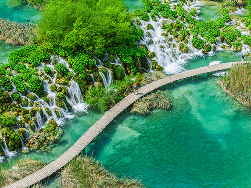 Aerial view of the Plitvice Lakes boardwalk over turquoise water