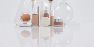 Assorted cosmetics and beauty products on a white surface